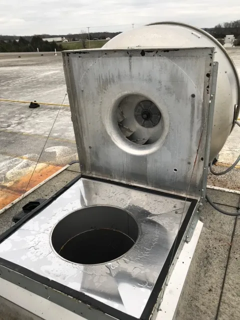 Newton hood cleaning technician servicing a commercial kitchen exhaust system